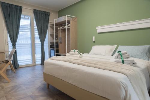 Postel nebo postele na pokoji v ubytování Gigli Rooms