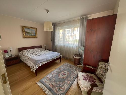 Postel nebo postele na pokoji v ubytování Cozy apartment with a large terrace and Sauna!