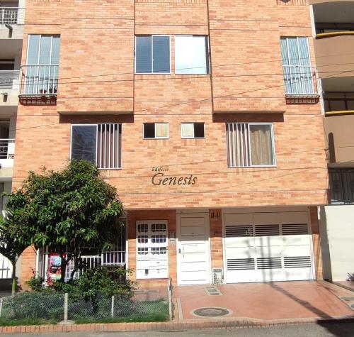 a brick building with a garage on the side of it at Moderno y Confortable San Alonso in Bucaramanga