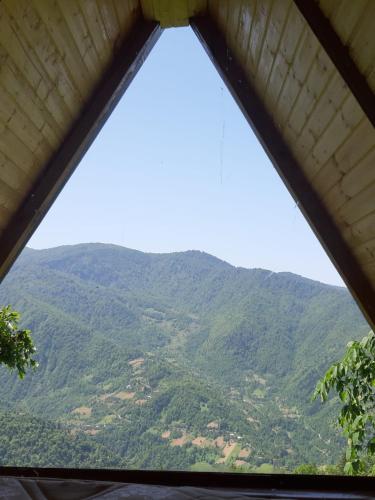 a view of a mountain from a window at cottage panorama merisi in Inasharidzeebi
