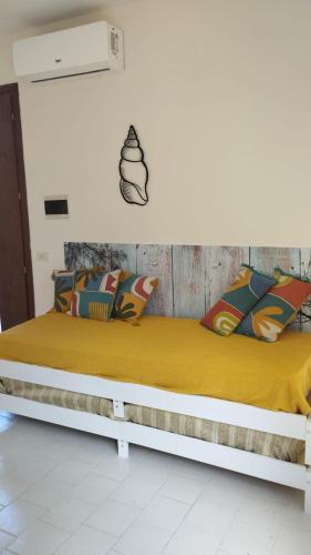 Postel nebo postele na pokoji v ubytování la torretta casale grandangolo