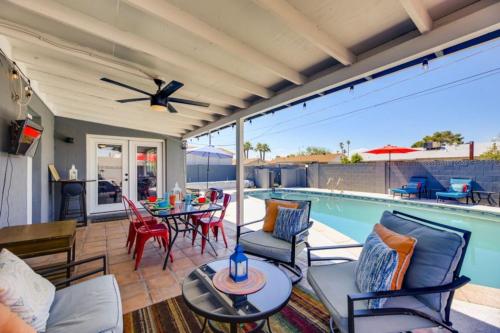 a patio with a table and chairs and a pool at Old Town, Single story with Pool,Bunk Beds, and Games in Scottsdale