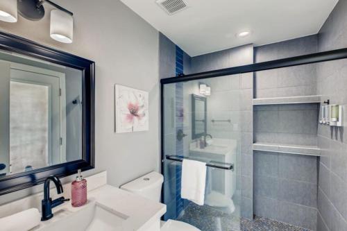 a bathroom with a sink and a toilet and a shower at Old Town, Single story with Pool,Bunk Beds, and Games in Scottsdale