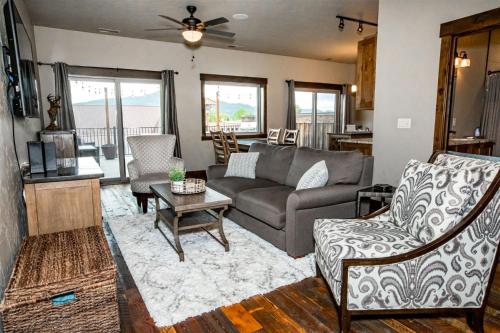 a living room with a couch and a table at Cana Loft 302 in Whitefish