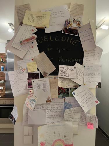 a bunch of notes on a refrigerator at Luxurious city apartment incl garage and terrace in Vienna