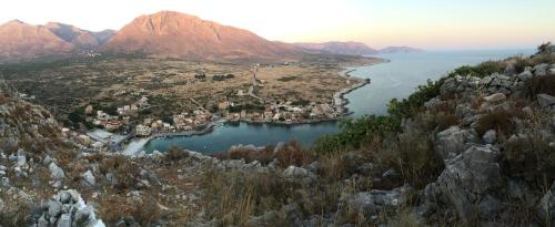 an aerial view of a small town on a mountain at Pyrgoi Theodorakaki: O Gerolimenas in Gerolimenas