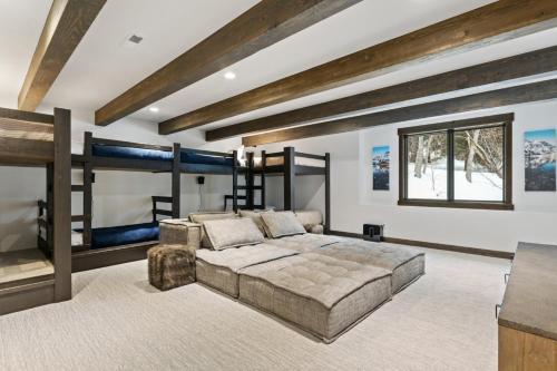 a bedroom with a large bed and a couch at Latitude Adjustment in Whitefish