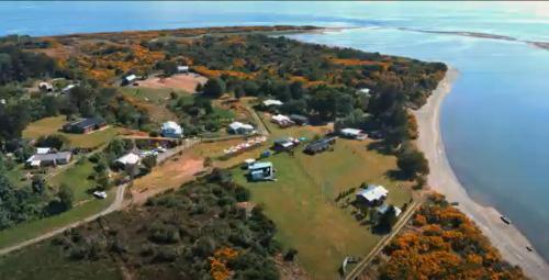 an aerial view of an island in the water at Cabañas Casatur para 6 personas en Ancud Chiloe in Ancud