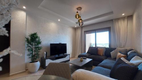 TV a/nebo společenská místnost v ubytování Appartement en Résidence avec Piscine
