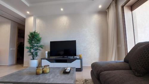 TV a/nebo společenská místnost v ubytování Appartement en Résidence avec Piscine
