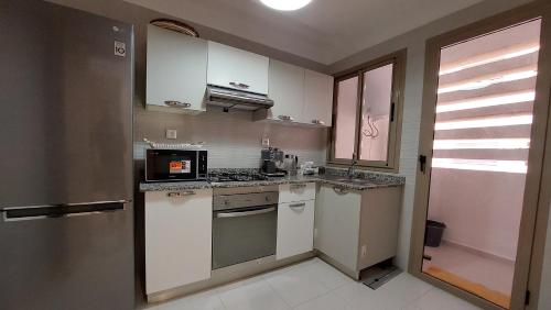 Kuchyň nebo kuchyňský kout v ubytování Appartement en Résidence avec Piscine