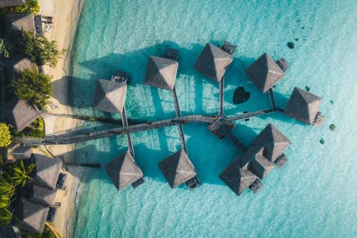 an aerial view of an island in the ocean at InterContinental Bora Bora Le Moana Resort by IHG in Bora Bora