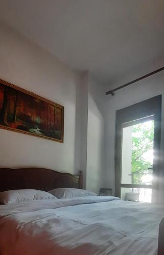 Postel nebo postele na pokoji v ubytování Fjori's Apartment