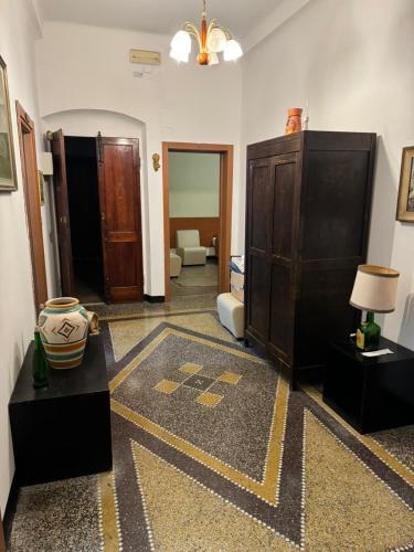 a room with a living room with a large room with at Casa Lorena in Rapallo