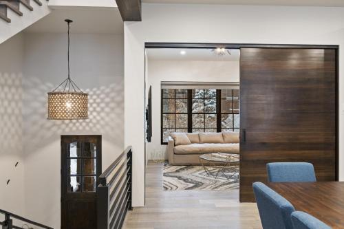 a dining room and living room with a sliding door at Slopeside 129 in Whitefish