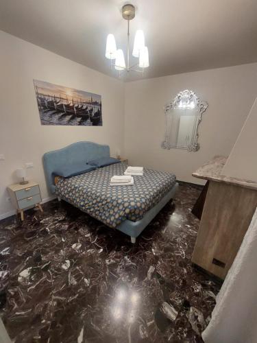 a room with a bed and a table on the floor at Residenza Donini in Venice Suite 1 in Venice
