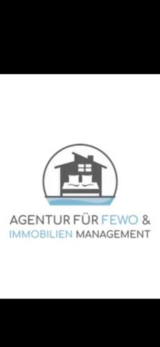 a company logo for a construction management company at Penthouse Schloßbühl in Uhldingen-Mühlhofen