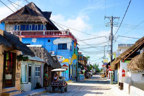 a blue building on the side of a street at Casa aloha-Isla Holbox in Holbox Island