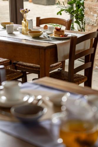 a table with plates of food on top at Pietraio in Radicondoli