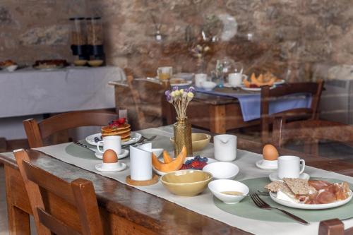 a table with eggs and food on top of it at Pietraio in Radicondoli
