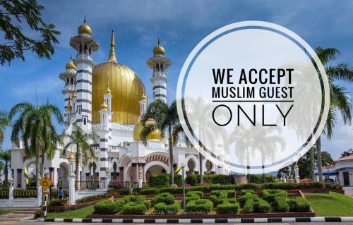 a mosque with a sign that says we accept muslim guest only at Sofea Homestay Ipoh in Ipoh
