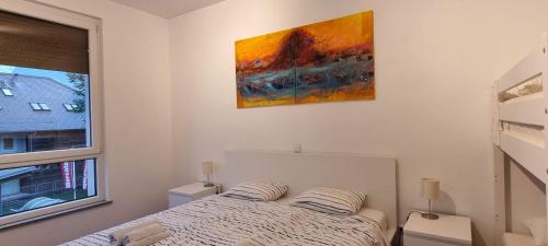 Ένα ή περισσότερα κρεβάτια σε δωμάτιο στο Apartma Valan