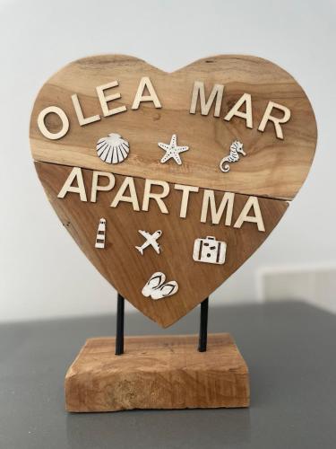 a wooden heart with a sign that says sea manarma at Olea Mar apartma in Pobegi