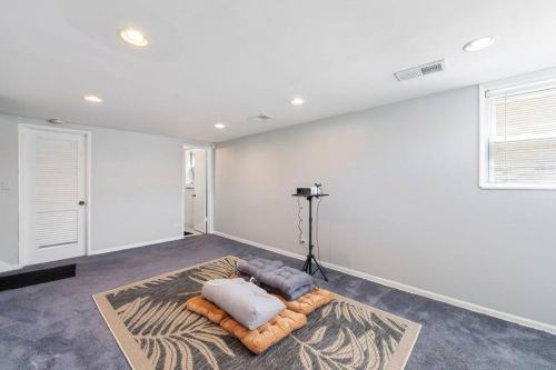 a room with two pillows sitting on a rug at Urban Oasis - Kid Friendly - Quiet Street in Skokie