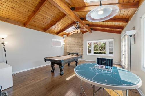 a room with a ping pong table and a ceiling at Urban Oasis - Kid Friendly - Quiet Street in Skokie