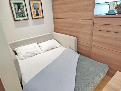 Ένα ή περισσότερα κρεβάτια σε δωμάτιο στο FLAT VARANDA PEDRA AZUL - Vista Azul Apart Hotel