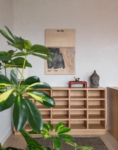 a room with wooden shelves and a plant at ROOST Kelly Drive in Philadelphia