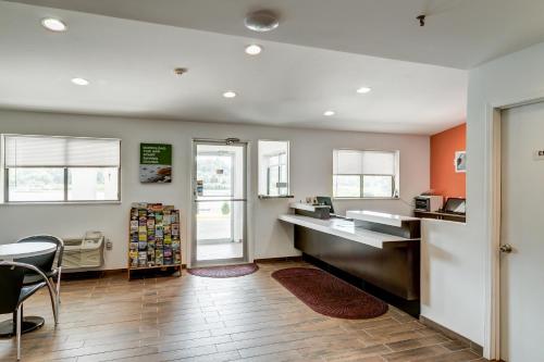 a kitchen with a counter and a table and chairs at Motel 6-Berea, KY in Berea