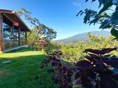 a house with a view of the mountains at Aldayah Tiny Village in Bajo Boquete