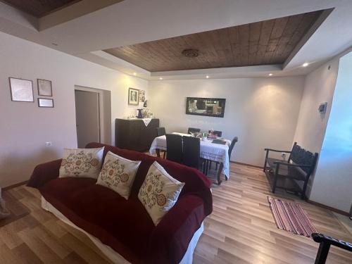 a living room with a couch and a table at Πυργοσπιτο Χαντζακου in Gythio