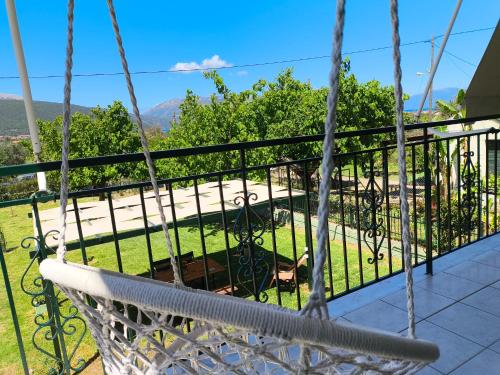 a hammock on a balcony with a view at Rosegarden in Sami