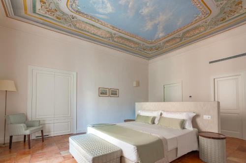 Postel nebo postele na pokoji v ubytování Aqua Mirabilis Relais de Charme