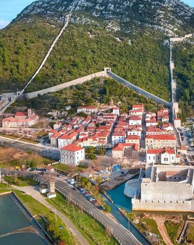 an aerial view of a town next to a river at Main Street Apartment in Ston