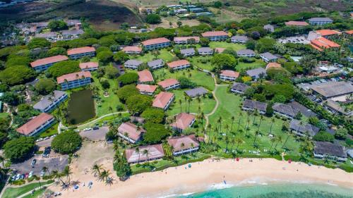 an aerial view of a resort next to the beach at Kiahuna 106 - Ocean View in Kipu