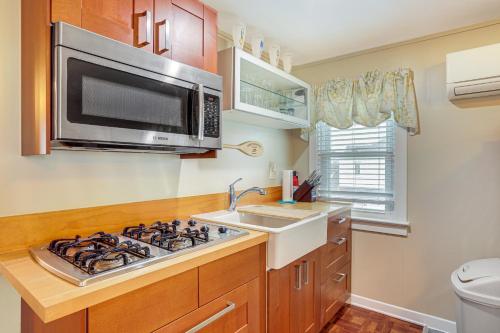 a kitchen with a stove and a microwave at Wildwood Crest Apartment, half Mi to the Beach in Wildwood Crest