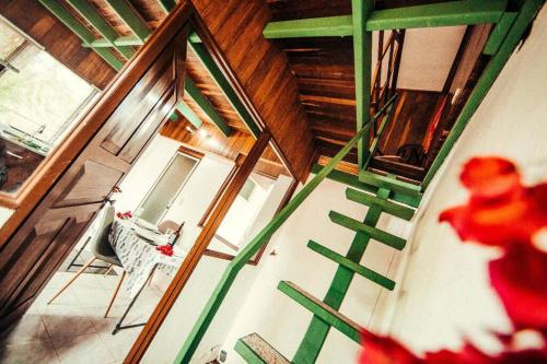 an overhead view of a room with a staircase in a house at Rainforest Cabin in Escazu in Escazu