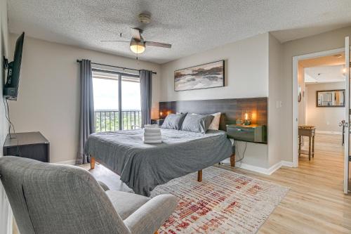 a bedroom with a bed and a couch and a chair at Mod Myrtle Beach Resort Condo with Beach Access in Myrtle Beach
