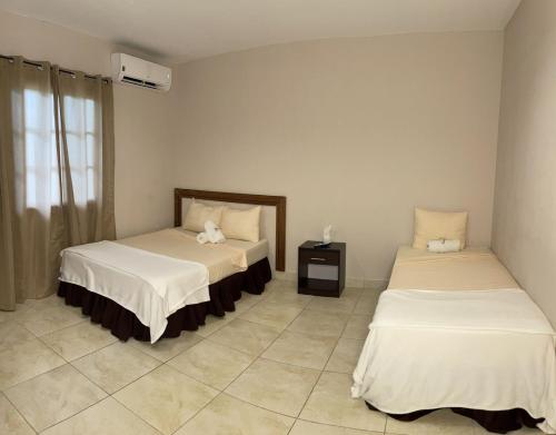 Posteľ alebo postele v izbe v ubytovaní Brisas de Coclé