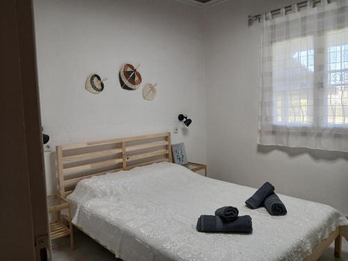Postel nebo postele na pokoji v ubytování Kanela House
