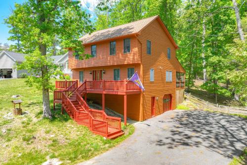 a large house with a deck on the side of it at McGaheysville Home with Screened Porch and Gas Grill! in McGaheysville