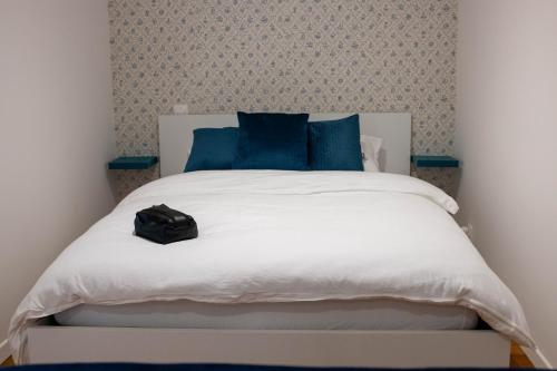 Ένα ή περισσότερα κρεβάτια σε δωμάτιο στο WAVY, studio centre ville DAX