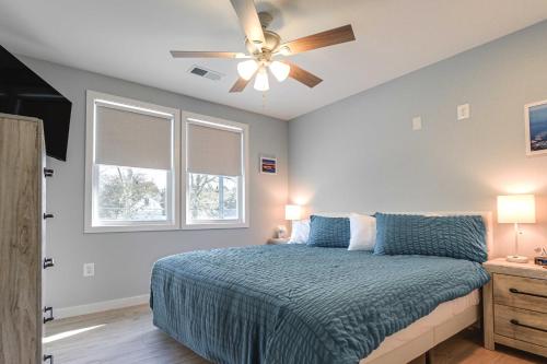 a bedroom with a bed and a ceiling fan at Waterfront Historical District Home Near River in North East