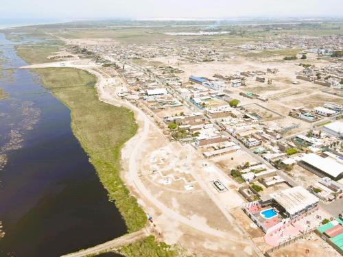 an aerial view of a port next to the water at Hospedaje Pariwana in Pisco