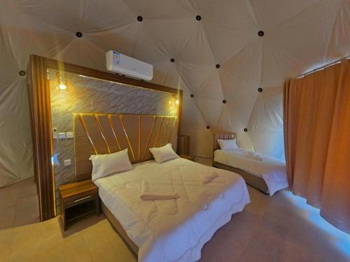 A bed or beds in a room at Sunrise Luxury Camp