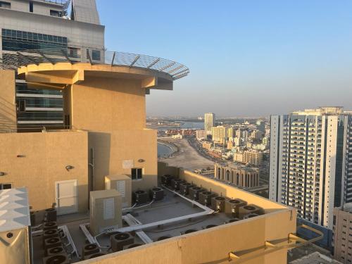 a view of a city from the top of a building at P3) Fantastic Seaview Room with shared bath inside 3bedroom apartment in Ajman 
