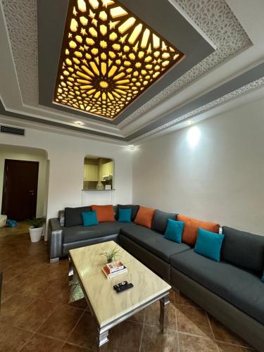 a living room with a couch and a coffee table at Appartement in Tetouan